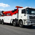 How Does a Rotator Tow Truck Maintain Stability During Heavy Lifting?