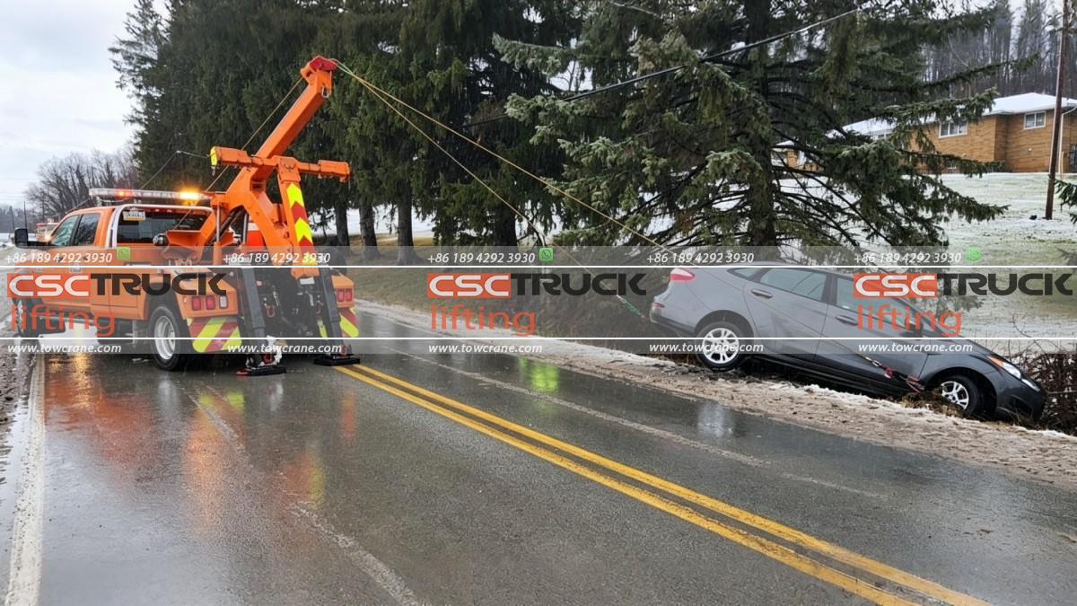 How Does a Wrecker Tow Truck Pull a Vehicle Out of a Ditch?